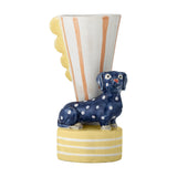 Dachsy Striped Stoneware Vase 21.5cm with a polka-dot dachshund on a striped yellow base beside a flared white and orange striped vessel with a scalloped edge, on a white background.