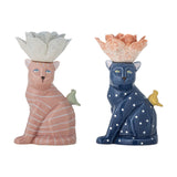 Eri Cat Stoneware Candle Holders, Set of 2, featuring a pink striped cat and a navy polka-dot cat, each with a flower-shaped candle cup and perched bird, on a white background.