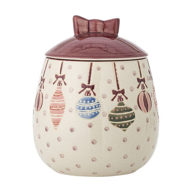 Ornamentia ceramic storage jar in cream with hand-painted hanging baubles and dots, deep red domed lid with bow-shaped knob, on a plain white background.