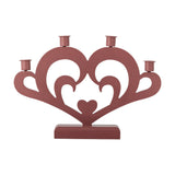 Salia Heart Advent Candle Holder in red MDF, a heart-shaped cut-out with scroll details and a small solid heart centre, holding four candle cups along the top, on a plain white background.