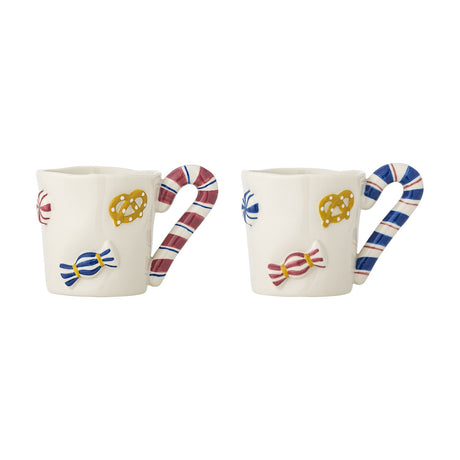 Set of two Candice embossed stoneware Christmas mugs with candy cane handles, white bodies hand-painted with sweets, pretzels, and peppermint designs.