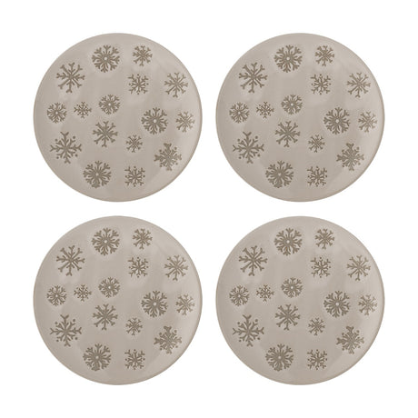 Set of four round beige stoneware side plates with embossed snowflake patterns in varying sizes, shown on a plain white background.