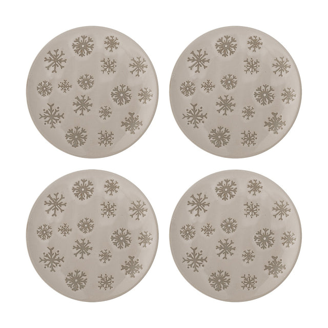 Set of four round beige stoneware side plates with embossed snowflake patterns in varying sizes, shown on a plain white background.
