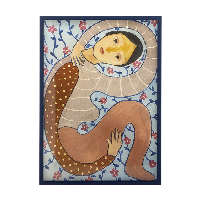 Floriesta Floral Wooden Framed Print in Multi, showing a hooded figure curled in an S-shape with dotted sleeve and resting hands amid a trailing floral vine background.