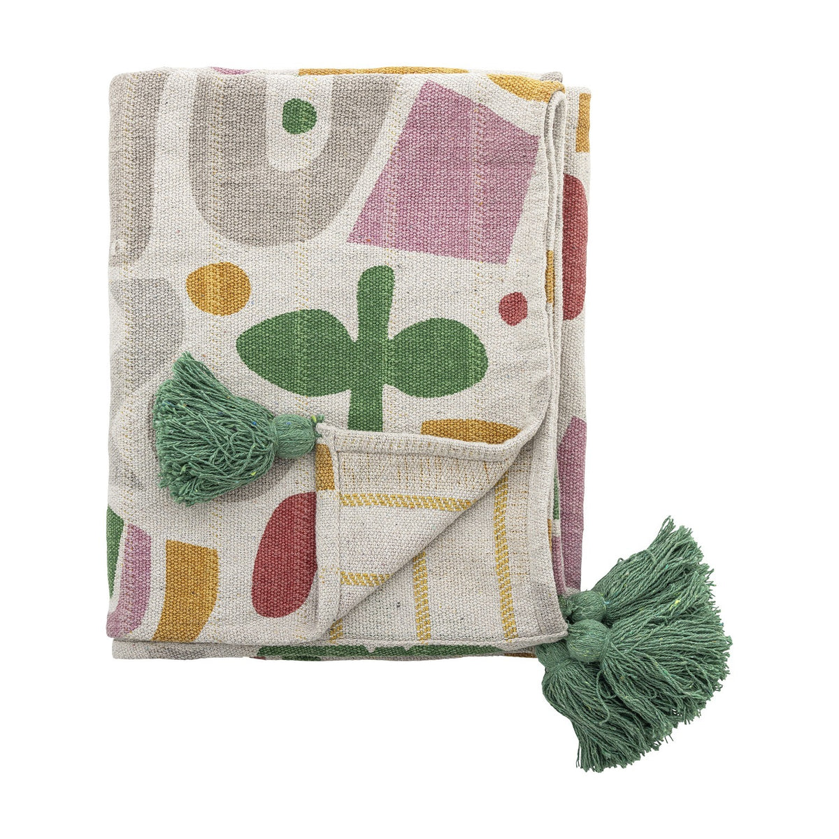 Filur Cotton Throw in Multi, folded showing an abstract shape print in pink, green, mustard and grey with green corner tassels, on a plain white background.