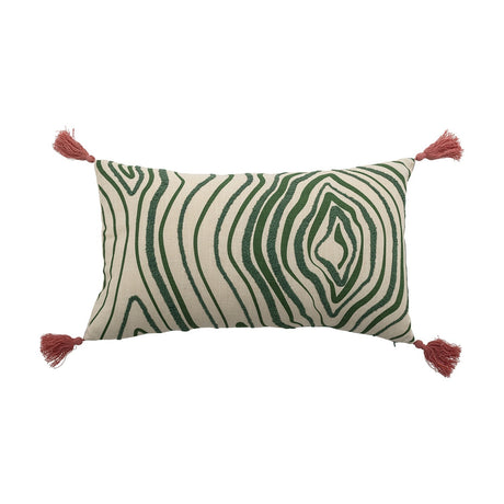 Woodsby Cotton Cushion in cream with a green wood-grain swirl pattern, tufted raised lines, pink tassels at each corner, on a plain white background.