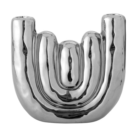 Shine Stoneware Candle Holder in Silver, a mirror-finish ceramic piece with nested U-shaped bands rising into two candle stems, shown on a plain white background.
