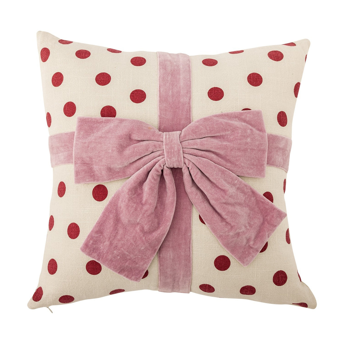 Bowie Dotted Cotton Christmas Cushion in cream with red polka dots, styled as a gift with a pink velvet ribbon and bow across the front, shown on a white background.