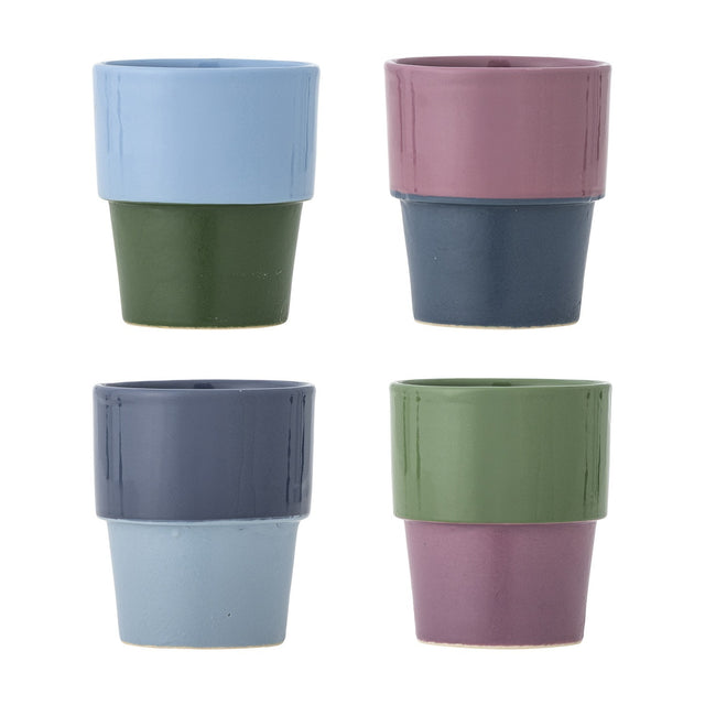 Ewan Blue Stoneware Cups, set of four 150ml ceramic cups in two-tone colour blocking—blue, pink, navy and green shades—on a plain white background.