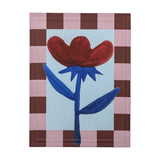 Vinia Floral Wooden Framed Print in multicoloured, featuring a red flower with blue stem and leaves on a pale blue background, bordered by a pink and brown checked wooden frame.