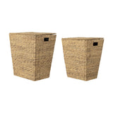 Mios Water Hyacinth Laundry Baskets, set of two tapered natural wicker hampers with hinged lids and cut-out handles, shown on a plain white background.