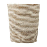 Selena Jute Basket in White, a tall round storage basket with alternating horizontal bands of white jute and natural seagrass, tapered base, and a braided rim, shown on a plain white background.
