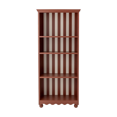 Sasha Striped Bookcase in red, a tall open shelving unit with four compartments, striped back panels, moulded cornice top and scalloped base, shown on a plain white background.