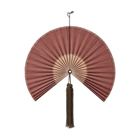 Jaime Bamboo Wall Decor in pink, a pleated fan-shaped wall art piece with a long hanging tassel at the hub, shown on a plain white background.