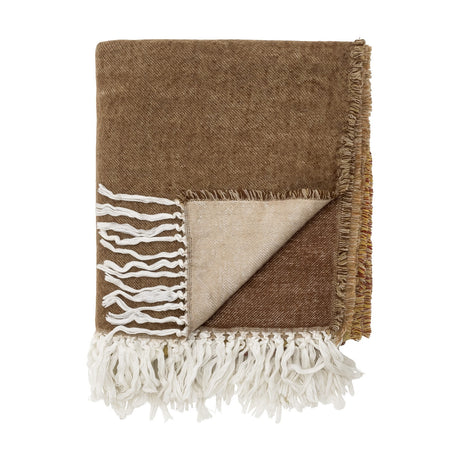 Ara Throw in brown woven acrylic, folded to show the paler reverse side and long white fringed tassels, on a plain white background.