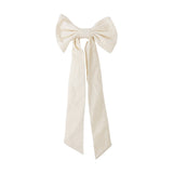Ruby Cotton Christmas Bow in cream woven cotton with two full loops and long tails, shown on a plain white background.