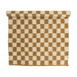 Chola Cotton Rug 200x140cm in Brown, a woven checkerboard pattern of brown and cream squares with softened edges and a textured, nubbly surface, partly rolled, shown on a plain white background.