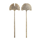 Lyas Iron Salad Servers Set of 2 in brass, long slender handles topped with ribbed ginkgo leaf-shaped heads, one whole and one notched, on a plain white background.