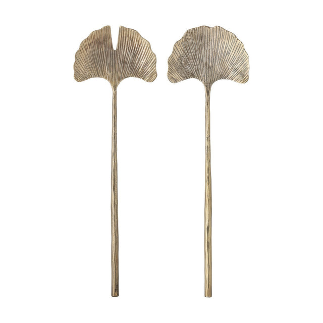 Lyas Iron Salad Servers Set of 2 in brass, long slender handles topped with ribbed ginkgo leaf-shaped heads, one whole and one notched, on a plain white background.