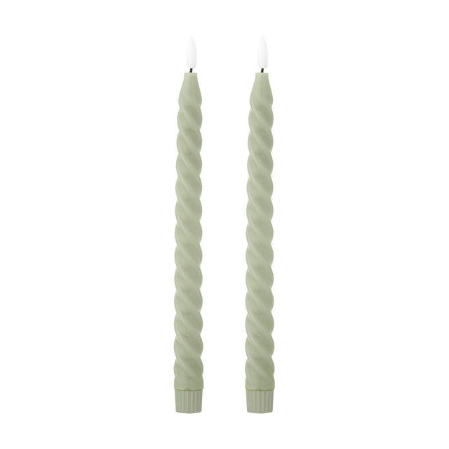Pair of Ponza LED taper candles in green paraffin wax with a spiral-twist body, fluted base, and flame-shaped tip, shown on a plain white background.