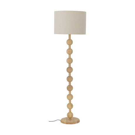 Giacoma Wooden Floor Lamp in natural wood, featuring a stacked sphere column stem on a round base with a cylindrical linen drum shade, shown against a plain white background.