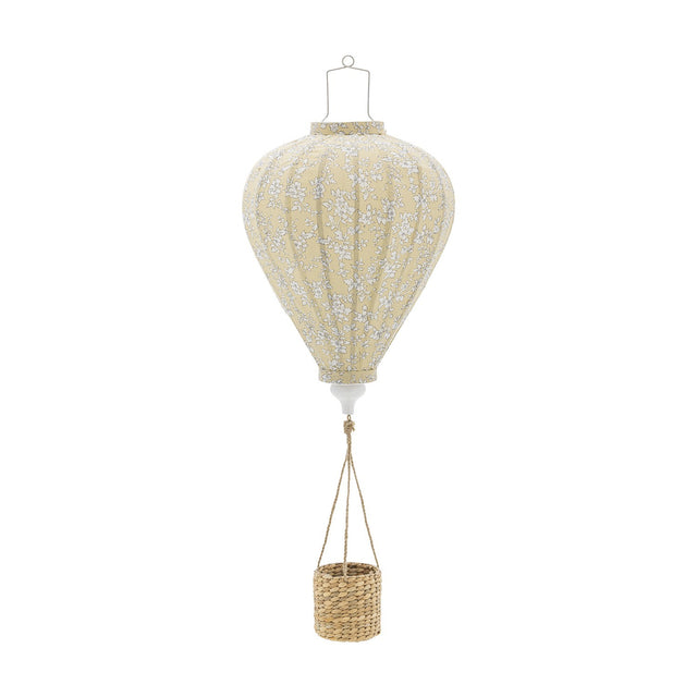 Pomp Floral Baby Mobile in yellow, a hot air balloon-shaped hanging decoration with ribbed fabric panels and small floral pattern, paired with a woven basket, shown on a plain white background.