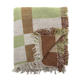 Galvin Checked Cotton Throw in green, brown and cream block check with long knotted fringe, partly folded to show both sides, on a white background.
