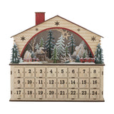 Melvin House Wooden Advent Calendar in beige plywood, shaped like a cottage with pitched roof, red chimney, star cut-outs, a lit winter scene with trees and a deer, and 24 numbered drawers below.