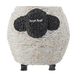 Dolly Sheep Water Hyacinth Basket in white, a round woven storage basket with a black sheep face, stitched sleepy eyes, two ears, and short raised legs, on a plain white background.