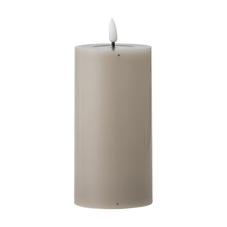 Ponza LED candle in beige, a paraffin wax pillar design with a recessed top and flame-shaped tip, shown on a plain white background.