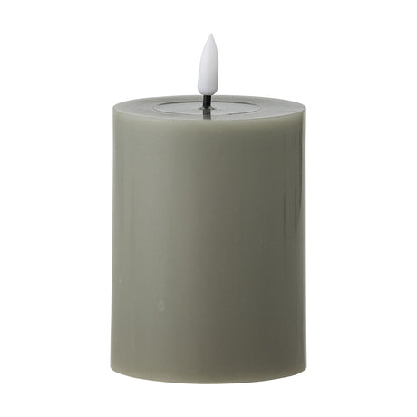 Ponza LED Candle 10cm in Green, a pillar-shaped flameless candle with paraffin-finish wax body and a white flame-tip LED, shown on a plain white background.