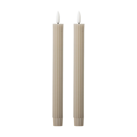 Ponza LED Candles Pack of 2 in beige paraffin wax, tall ribbed columns with flame-shaped white tips, set on a plain white background.