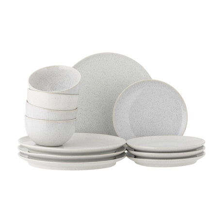 Addison Speckled Stoneware Dinner Set of 12 in white, showing stacked bowls, side plates and dinner plates with a speckled reactive glaze on a plain white background.
