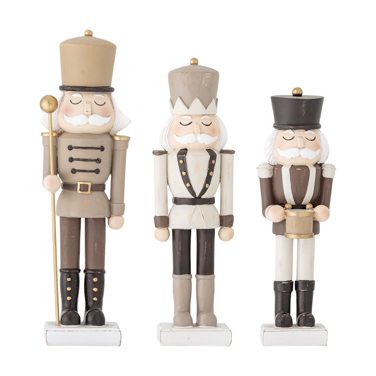Darryl Resin Christmas Decorations Set of 3 in brown, three nutcracker-style figures with tall hats, moustaches and buttoned jackets, one holding a staff, one a drum, on a plain white background.