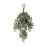 Hanging cedar Christmas decoration with a wrapped loop, green needled sprigs, frosted tips, pinecones, and berry clusters tapering to a single twig, shown on a white background.