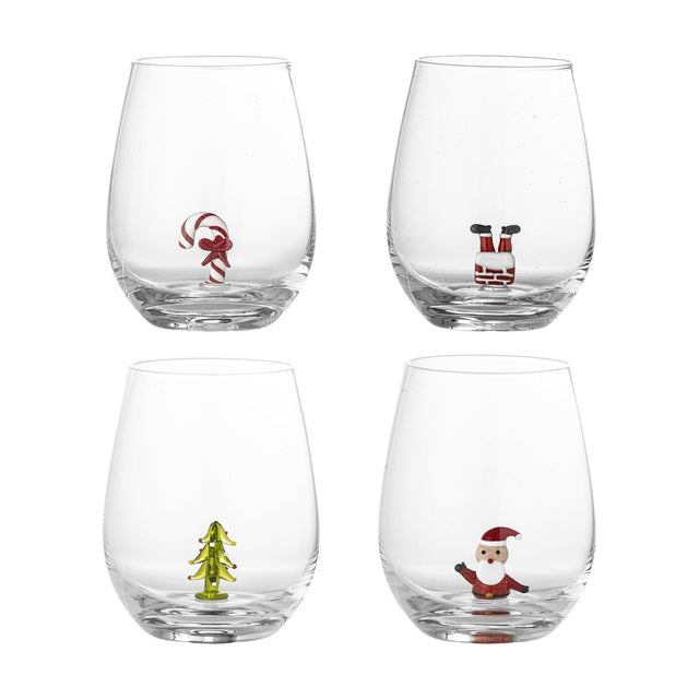 Misa Christmas Tumblers Set of 4 in clear glass, each stemless tumbler featuring a small figure at the base: candy cane, Santa in a chimney, Christmas tree, and waving Santa, on a white background.