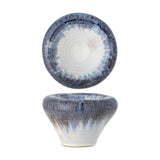 Finna Stoneware Bowl 17cm in Blue, shown from above and in profile, with a tapered ceramic body, small foot, and rolled rim in deep blue drip glaze over white, on a plain background.
