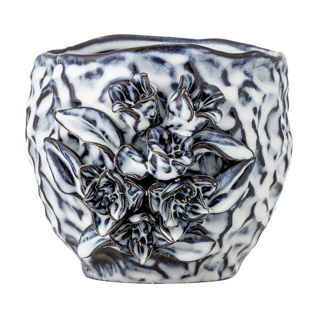 Malina Floral Stoneware Plant Pot in blue with a rippled, crinkled texture and a raised floral and leaf cluster in relief on one side, shown on a plain white background.