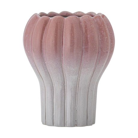 Kyla Stoneware Plant Pot in pink, a ribbed fluted bowl with scalloped rim tapering to a narrower white base, shown on a plain white background.