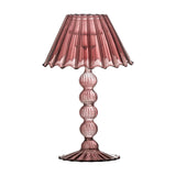Cisco pink glass tealight holder shaped like a table lamp, with a fluted wavy-edged shade on a stem of stacked glass beads and a scalloped round foot, on a white background.