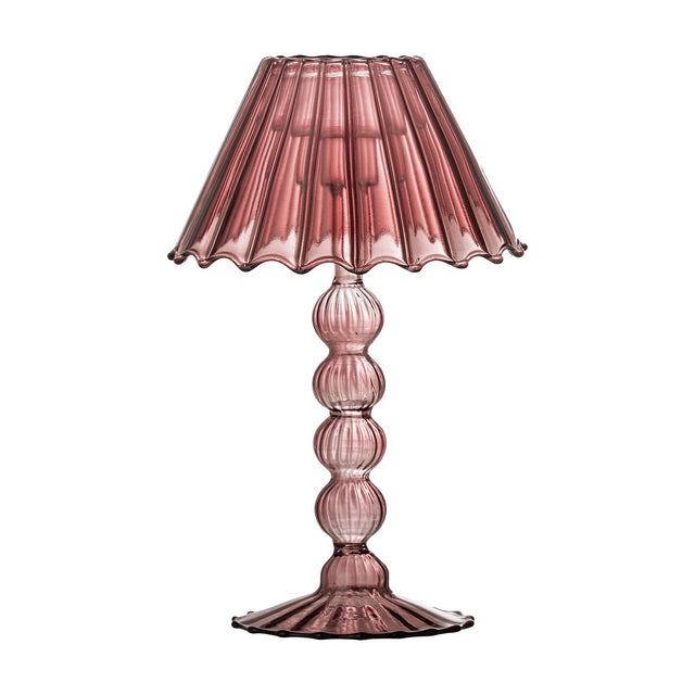 Cisco pink glass tealight holder shaped like a table lamp, with a fluted wavy-edged shade on a stem of stacked glass beads and a scalloped round foot, on a white background.