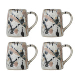 Set of four Winnie stoneware mugs with looped handles, each in a multicoloured reactive glaze showing black, pink and grey splashes and speckles, shown on a plain white background.