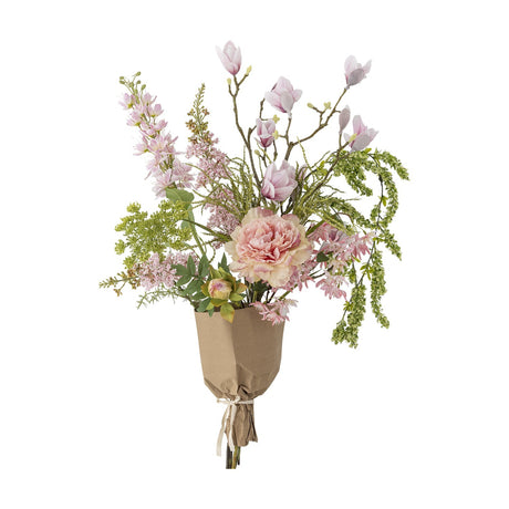 Pink Breeze artificial bouquet with magnolia-style blossoms on bare branches, a ruffled peony, frilled flower heads and trailing foliage, wrapped in kraft paper.