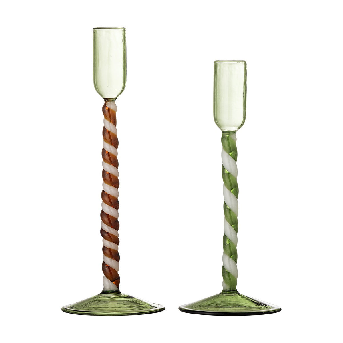 Set of two mouthblown glass candle holders in translucent green with twisted spiral stems in brown-white and green-white, flared round bases, tall narrow cups, on a white background.