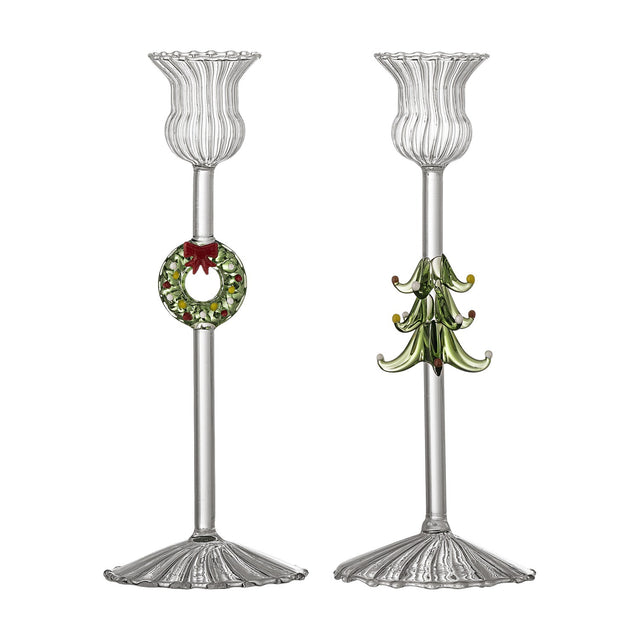 Set of 2 clear glass Branton Christmas candle holders with fluted scalloped cups, ribbed flared feet, and wreath-and-bow or tiered tree stem designs, on a white background.