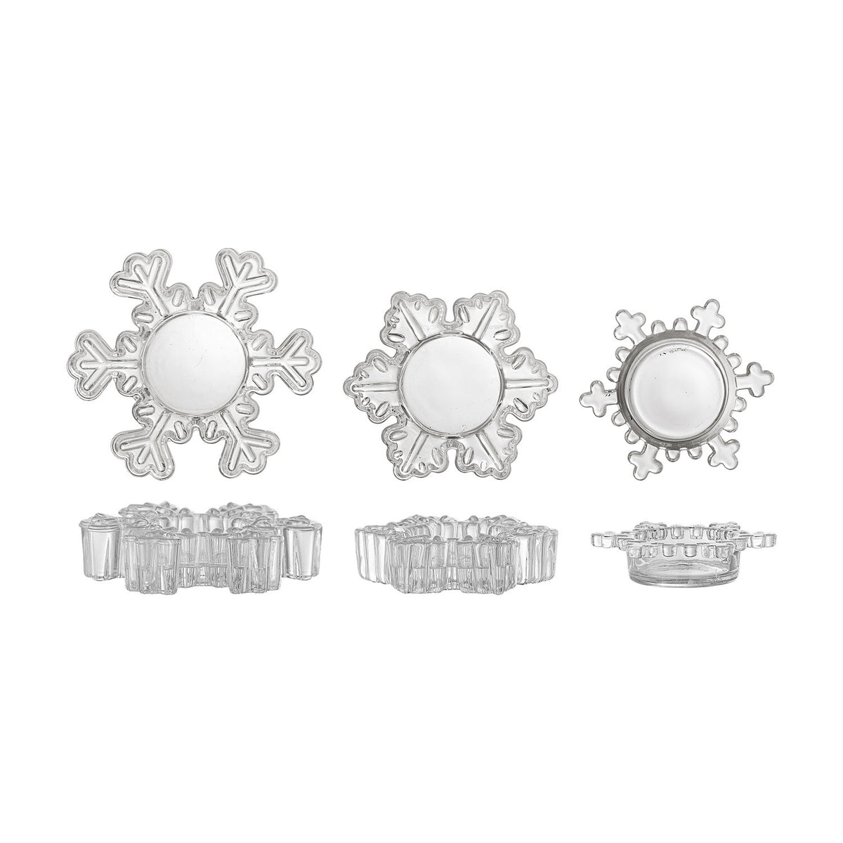 Set of three clear glass snowflake-shaped tealight holders in varying sizes and designs, shown from above and side views on a plain white background.