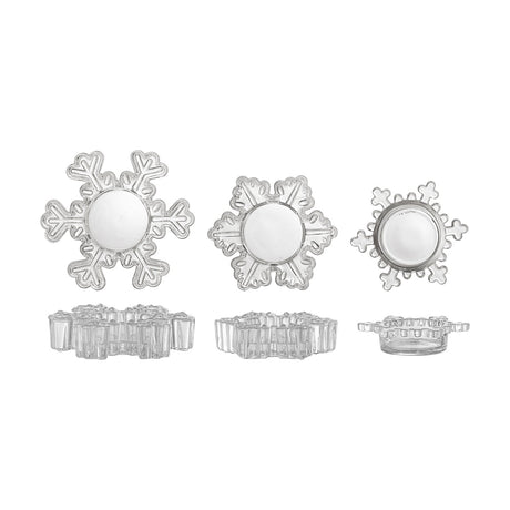 Set of three clear glass snowflake-shaped tealight holders in varying sizes and designs, shown from above and side views on a plain white background.