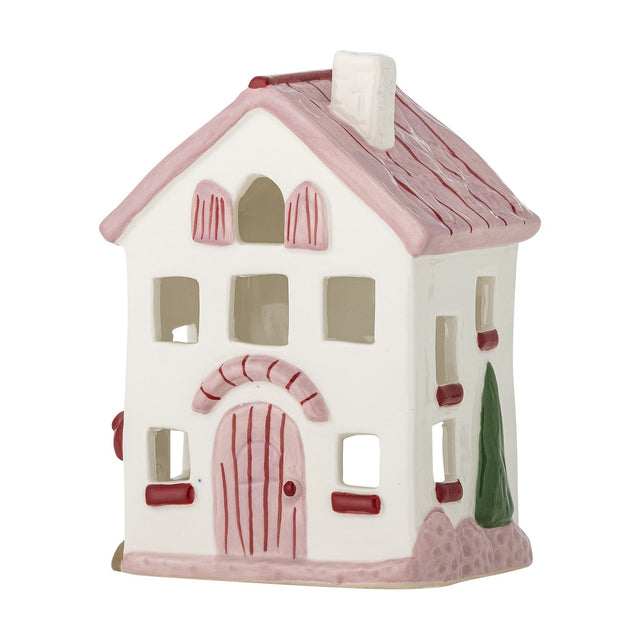 Shirly House stoneware tealight holder shaped like a two-storey home, with white walls, a pink pitched roof and chimney, cut-out windows, and a pink arched door, shown on a plain white background.