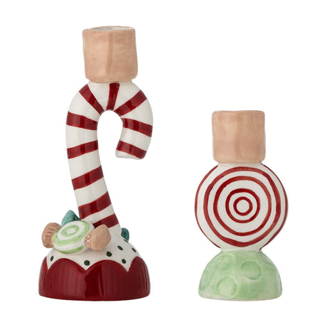 Set of 2 Leiani ceramic Christmas candle holders, a red-and-white candy cane on a scalloped base and a round striped sweet on a green dimpled foot, both with peach cup tops.
