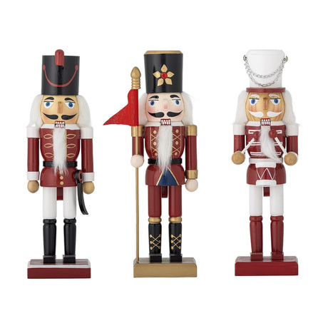 Darren Wooden Christmas Decorations set of 3 red nutcracker soldier figures with sabre, flag pole, and drum, on red bases against a white background.